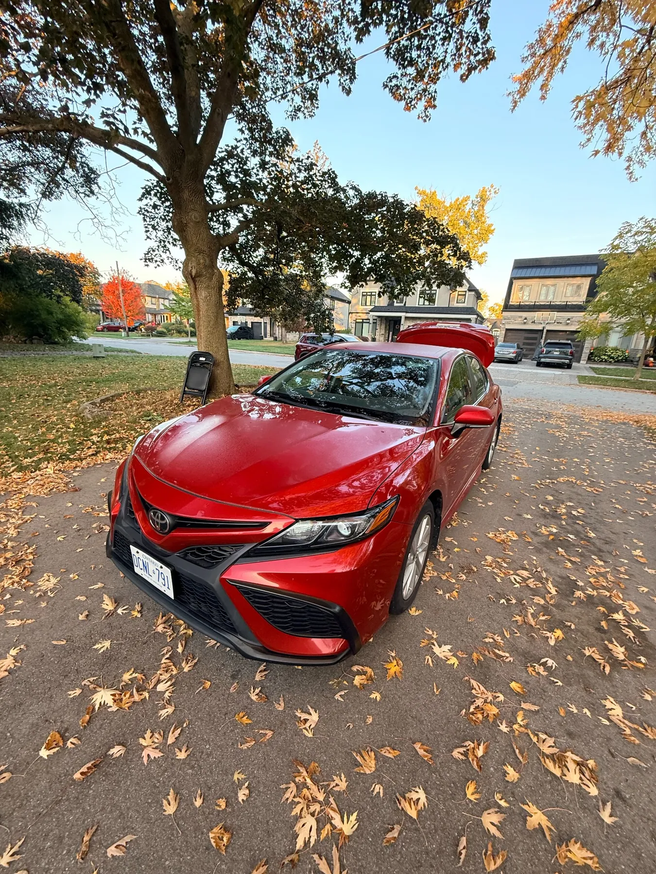 Red Toyota Camry with a polished finish