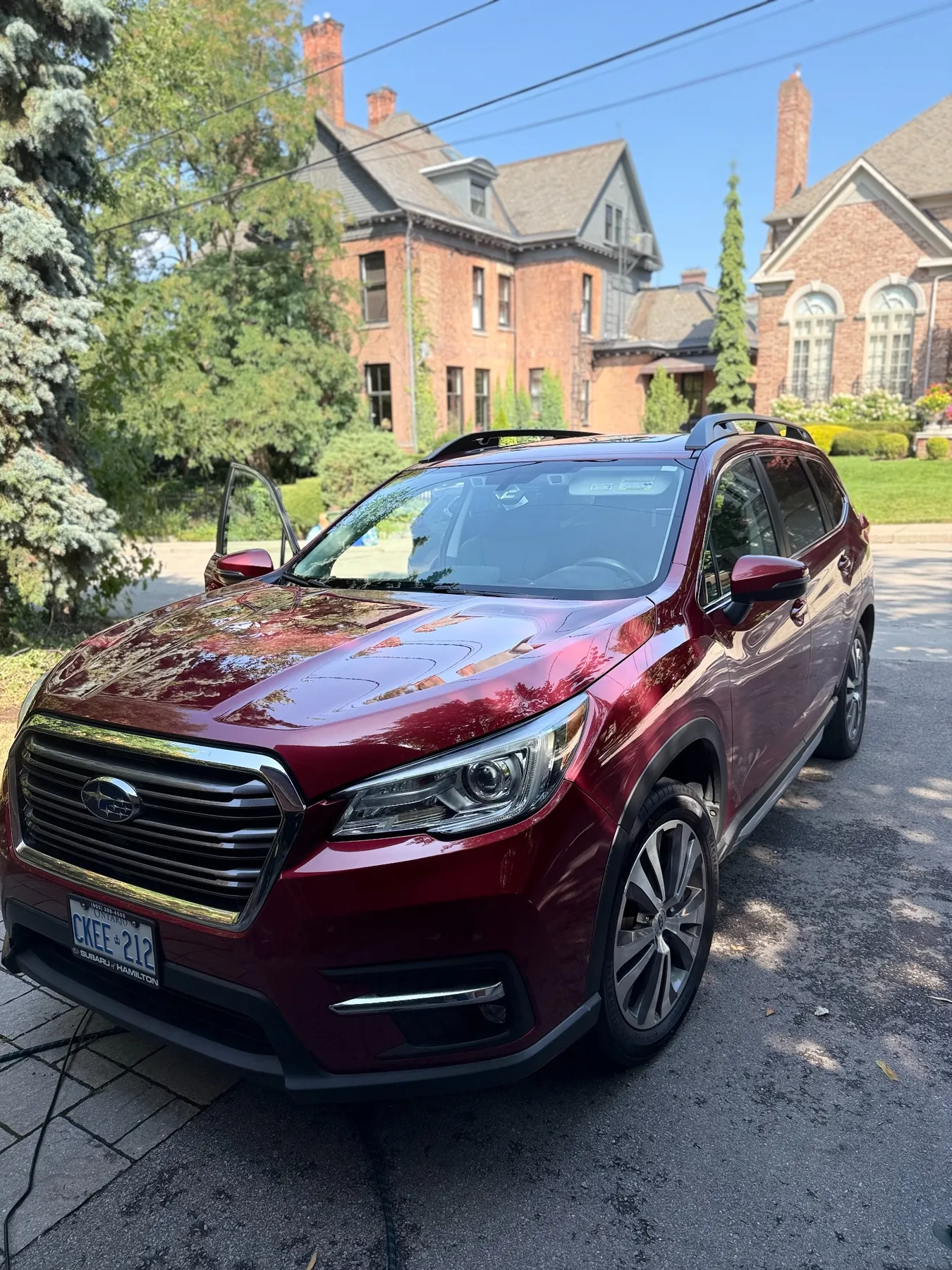 Deep red Subaru SUV after detailing